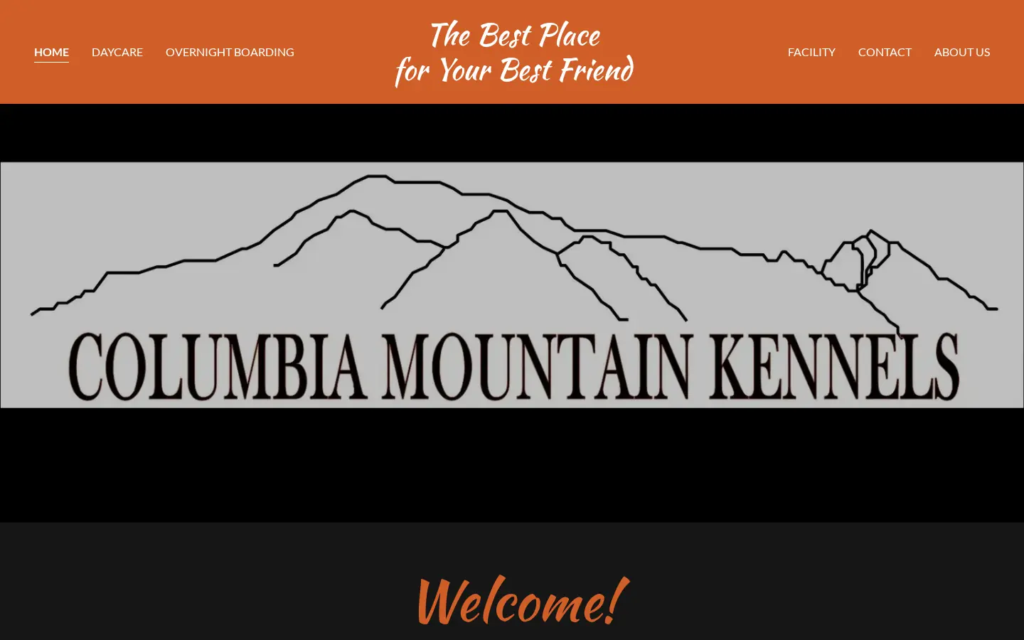 Columbia Mountain Kennels previous GoDaddy homepage with orange band, Welcome heading, and dated template layout